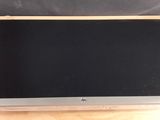 a close up of a laptop computer sitting on a wooden table