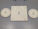 a picture of a white plate with four plates on it