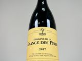 a close up of a bottle of wine on a table
