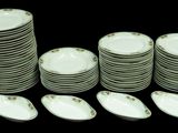 a lot of plates and spoons sitting on a table