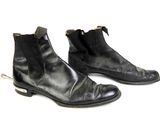 pair of black leather boots with zippers on each side