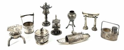 a lot of silver items that are on a white surface