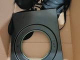 a box with a speaker and a pair of shoes in it