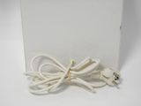 a white box with a white power cord attached to it