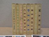 three books sitting on top of a table next to each other