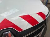 a red and white stripe on the hood of a truck