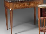 an image of a table with a marble top next to a chair