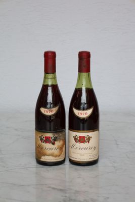 two bottles of wine that are sitting on a table