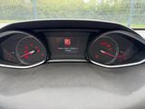 a close up of a car dashboard with gauges and numbers
