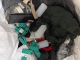 a bag full of clothes and other items in it
