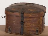an old wooden box sitting on top of a cardboard box