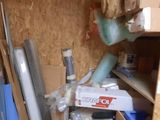 a room with a lot of boxes and tools in it