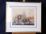 painting of a cityscape in a gold frame on a black background