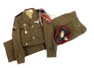 an image of a uniform of a soldier with medals and a hat