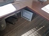 an image of a desk with a computer monitor and a keyboard
