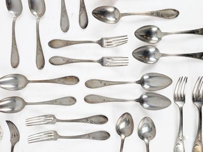 a lot of silver spoons and forks on the table