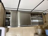 a stainless steel oven in the middle of a kitchen