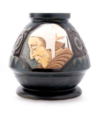 a black vase with a picture of a man and a woman on it