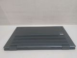 a laptop that is sitting on a white table
