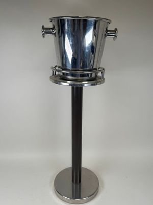 stainless steel ice bucket on pedestal on white background
