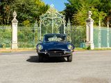 a car that is parked in front of a gate