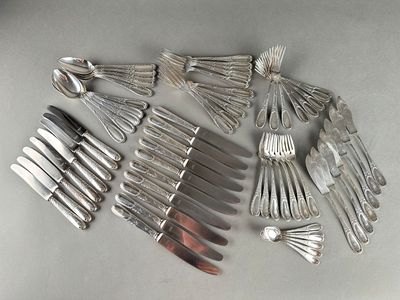 a lot of forks and spoons on the table