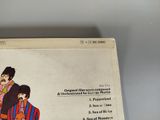 an image of a picture of the beatles album on a table