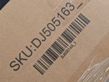 a box with a barcode on it that is wrapped in plastic