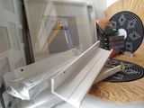 a fan sitting on top of a window sill next to a fan