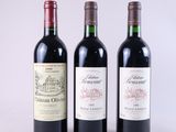 trois bouteilles de vin posées l'une à côté de l'autre sur une table