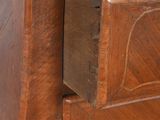 an old wooden dresser with a drawer in it