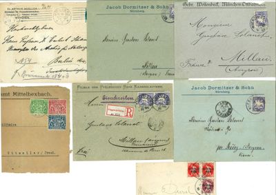 several old envelopes with different stamps and stamps on them