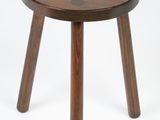 an image of a small wooden stool on a white background