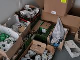 many boxes of assorted items sitting on the floor