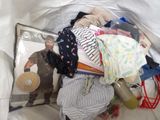 a bag full of clothes and a picture of a man