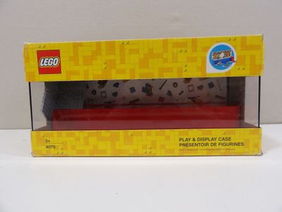 a box with a toy train in it on a table