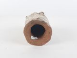 a small piece of clay sitting on a white surface