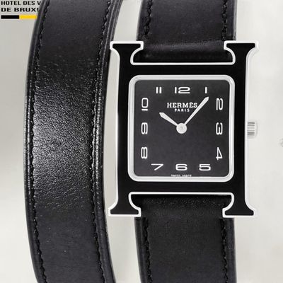 black leather watch with silver face and black leather band