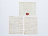 un gros plan sur une feuille de papier portant un cachet de cire