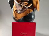 brown silk scarf on a mannequin head with a red box