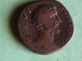 a close up of a coin on a green surface