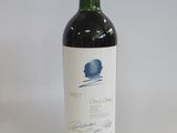 a bottle of wine that is sitting on a table