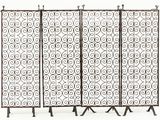 a group of four metal screens with scrolls and scrolls on them