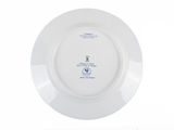 a white plate with a blue and white design on it