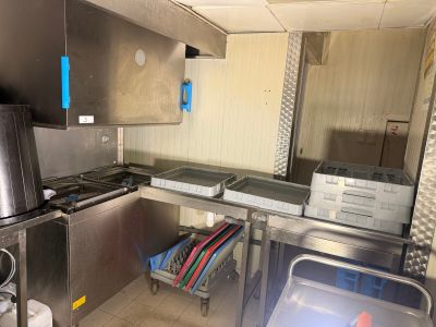 a kitchen with stainless steel cabinets and a refrigerator