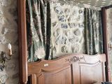 a bed with a canopy in the middle of a room