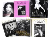 Plusieurs livres consacrés à divers films sont disposés sur une surface blanche