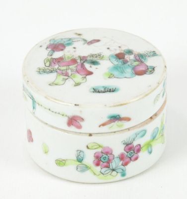 a small white box with a floral design on it
