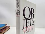 a book that is sitting on a table next to a stack of books