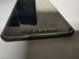 a close up of a cell phone on a table